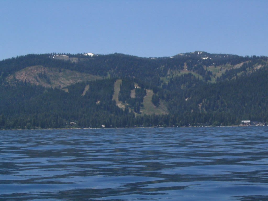 Homewood Mountain Resort's ski runs on the mountainside above Lake Tahoe, seen from the water
