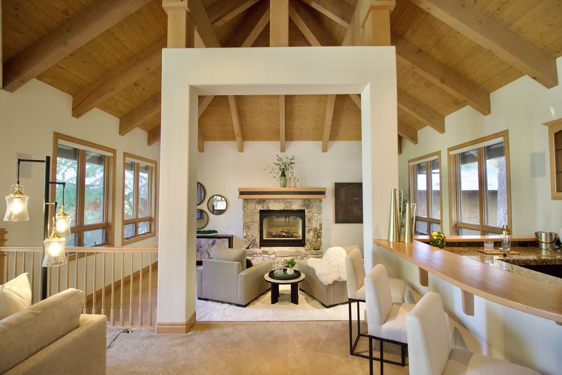 Staged fireplace sitting room framed by an open doorway